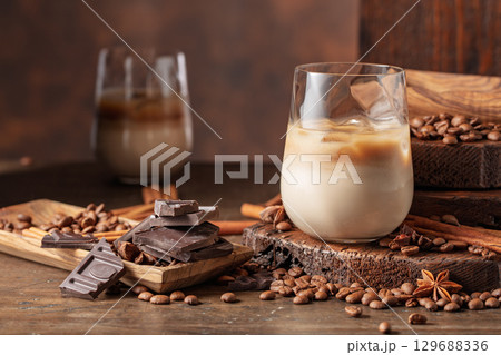 Cream and coffee cocktail in glasses with ice. 129688336