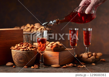 Italian liqueur Amaretto with almonds nuts. Italian liqueur Amaretto with almonds nuts. 129688361