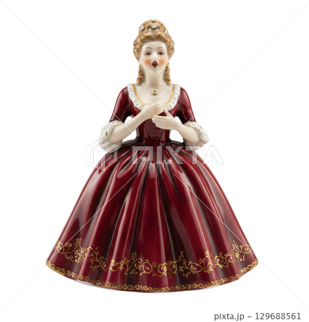 Elegant porcelain figurine of a woman in a vintage red rococo dress singing a solo opera 129688561
