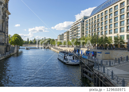 Berlin, Germany - July 01, 2018: View of the river Spree and the embankment of Berlin. Berlin, Germany - July 01, 2018: View of the river Spree and the embankment of Berlin. 129688971
