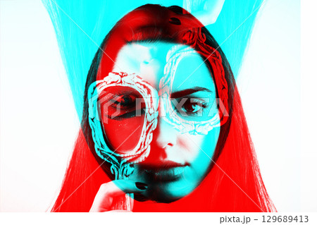 Beautiful woman covers her one eye with old mirror Beautiful woman covers her one eye with old mirror 129689413
