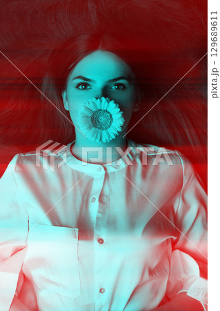 Woman with long hair and flower in her mouth in RGB color split effect style 129689611