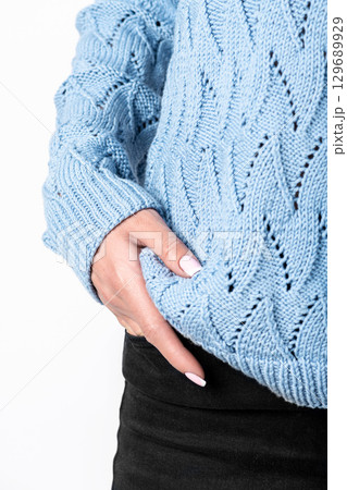 Close-up shot of woman wearing blue sweater and jeans 129689929