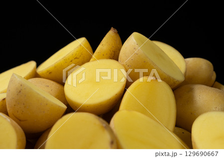 Fresh Raw Potatoes Cut In Half Close-Up Macro View. 129690667