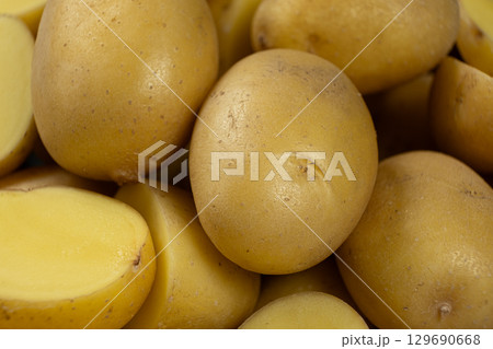 Fresh raw unpeeled potatoes close-up 129690668