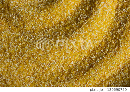 Raw Yellow Corn Grits Close-Up Texture 129690720
