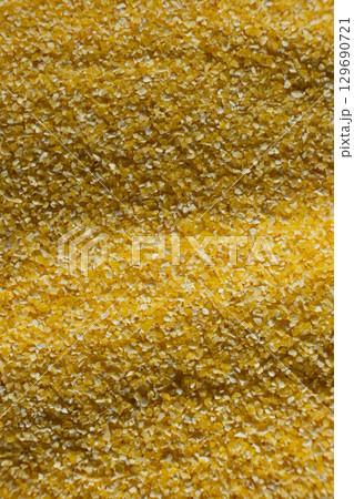 Raw Yellow Corn Grits Close-Up Texture 129690721