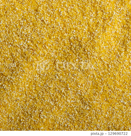 Raw Yellow Corn Grits Close-Up Texture 129690722