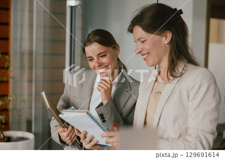 Professional Women Participating Actively in Engaging Business Discussion and Collaboration Professional Women Participating Actively in Engaging Business Discussion and Collaboration 129691614