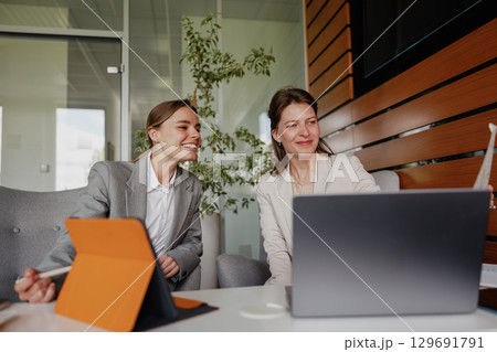 Engaging in a Collaborative Business Meeting Held in a Modern and Innovative Office Setting Engaging in a Collaborative Business Meeting Held in a Modern and Innovative Office Setting 129691791