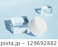 White cosmetic jar on light blue background with glass cubes minimal beauty skincare concept 129692882