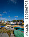 Colorful boats on a sunny day. View of the quay on the River Deben in the historic town of Woodbridge in Suffolk, UK. 129696708