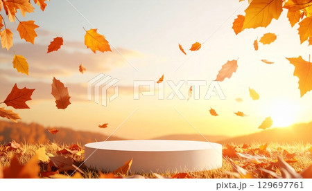 Autumn Leaves Falling on a Display Podium at Sunset in Golden Landscape 129697761