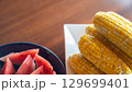 夏を彩るトウモロコシとスイカ 129699401
