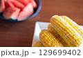 夏を彩るトウモロコシとスイカ 129699402