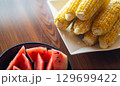 夏を彩るトウモロコシとスイカ 129699422