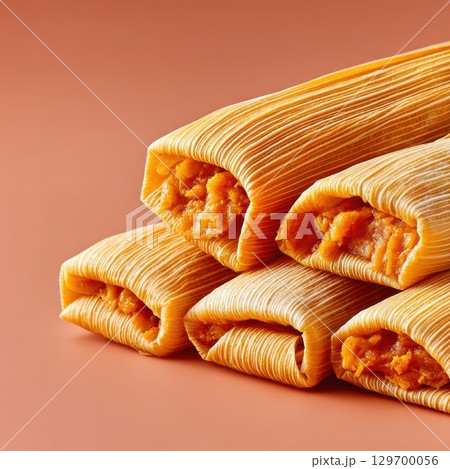 Delicious and Colorful Tamales Served on a Smooth Surface for Authentic Mexican Cuisine Experience Delicious and Colorful Tamales Served on a Smooth Surface for Authentic Mexican Cuisine Experience 129700056