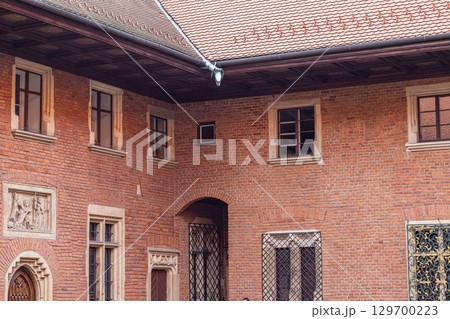 Wawel Royal Castle courtyard with red brick facade Wawel Royal Castle courtyard with red brick facade 129700223