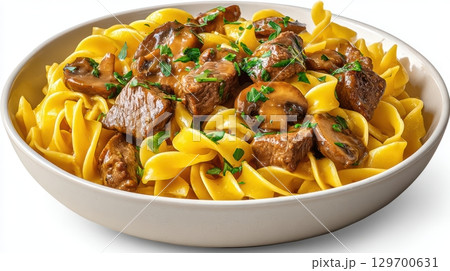 Delicious Beef Stroganoff with Tender Meat, Mushrooms, and Egg Noodles Served in a White Bowl 129700631