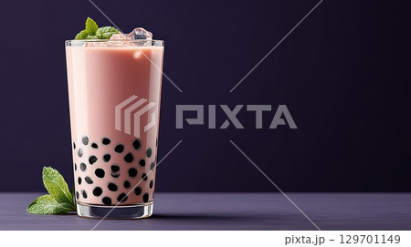 Refreshing Bubble Tea with Tapioca Pearls and Mint Garnish on a Dark Background Refreshing Bubble Tea with Tapioca Pearls and Mint Garnish on a Dark Background 129701149