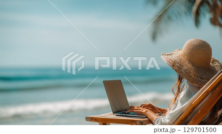 Woman working on laptop by the ocean, enjoying remote work and seaside freedom 129701500
