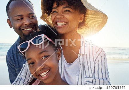 Black family, happy and beach sunshine portrait together for travel holiday, summer vacation or bonding outdoor. Parents smile, child happiness and relax quality time on ocean sea water for adventure 129705373