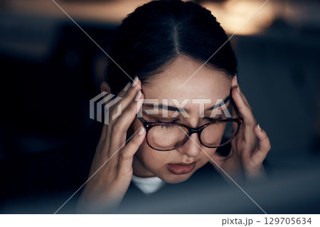 Headache, stress and business woman at night working on computer for project, report and strategy deadline. Burnout, mental health and female worker in dark office frustrated, tired and overworked Headache, stress and business woman at night working on computer for project, report and strategy deadline. Burnout, mental health and female worker in dark office frustrated, tired and overworked 129705634
