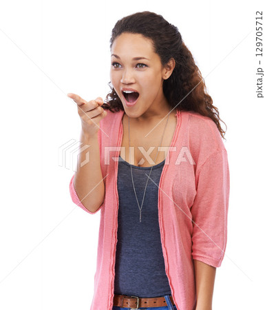 Excited, pointing and black woman surprise, shocked or happy girl isolated on white studio background. African American female, lady and point with achievement, marketing or advertising with discount 129705712