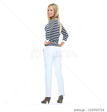 Woman, studio portrait and happy by white background with smile, beauty and jeans with hands on hips. Model, fashion and denim aesthetic with happiness, trendy style and blonde hair with edgy shoes 129705724