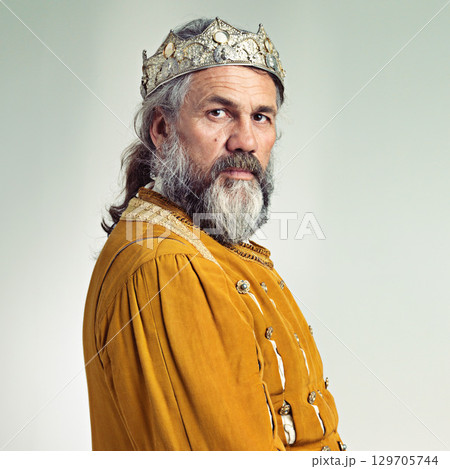 King, crown with senior man and portrait, history with renaissance and royalty isolated on white background. Vintage, medieval and worship, face and male monarch mockup with gold and cosplay 129705744