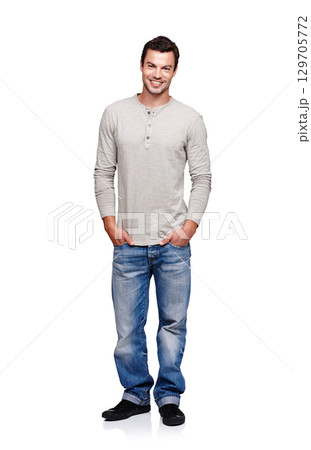 Portrait, smile and man with hands in pocket in studio isolated on a white background looking happy. Pride, cool and model male posing in denim jeans clothes for trendy style and positive mindset Portrait, smile and man with hands in pocket in studio isolated on a white background looking happy. Pride, cool and model male posing in denim jeans clothes for trendy style and positive mindset 129705772