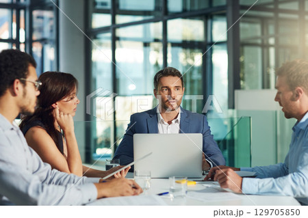 Leadership, laptop and business people in meeting for planning project, marketing strategy and ideas. Teamwork, collaboration and group of employees at desk brainstorming goals, target and vision 129705850