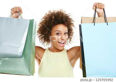 Portrait, shopping and retail with a black woman in studio isolated on a white background while holding shopping bags. Store, customer and discount with a female model on black space for marketing 129705992
