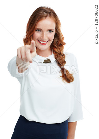 Happy, portrait and woman pointing her finger in a studio with a stylish, edgy and classy outfit. Happiness, smile and female model point for direction or sign language isolated by a white background 129706022