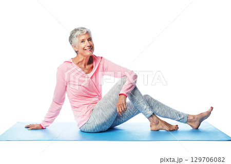 Yoga portrait, senior and woman in studio isolated on a white background. Zen chakra, pilates fitness and retired, elderly and happy female sitting on mat after training for wellness and health. 129706082
