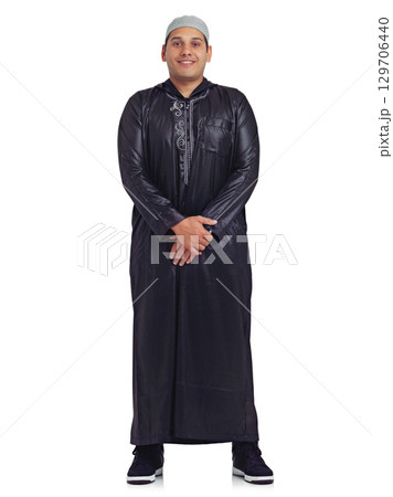 Muslim, religion and happy man portrait with a islamic dress with a smile about faith. White background, isolated and young arabic person smiling with happiness and culture in a studio alone Muslim, religion and happy man portrait with a islamic dress with a smile about faith. White background, isolated and young arabic person smiling with happiness and culture in a studio alone 129706440
