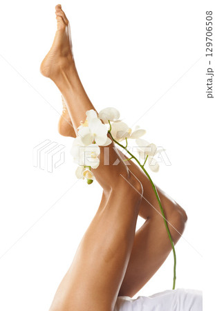 Legs, foot and flower with woman in beauty mockup, natural cosmetics, skin with skincare isolated on white background. Pedicure, epilation and waxing for body hair removal, glow and dermatology 129706508
