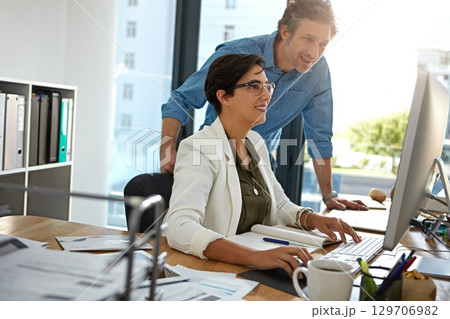 Corporate, man and woman with computer, talking and online reading for strategy, marketing and modern office. Manager, coworkers or female employee with digital advertising, explain system or process Corporate, man and woman with computer, talking and online reading for strategy, marketing and modern office. Manager, coworkers or female employee with digital advertising, explain system or process 129706982