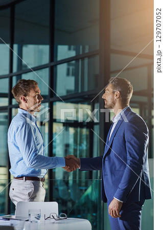 Handshake, partnership and business man with b2b interview, welcome and ceo success or deal. Business meeting, shaking hands and corporate manager thank you, introduction and agreement in an office 129707052