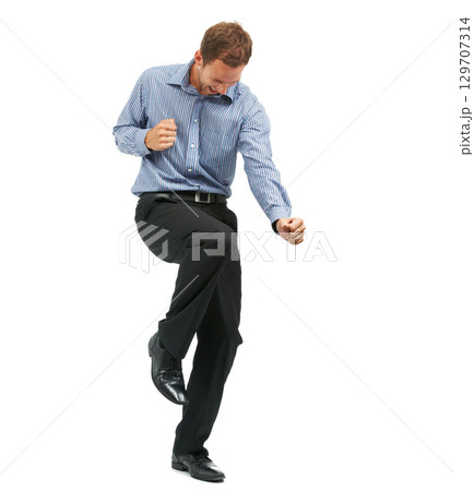 Happy, dance and businessman in studio for celebration, success and good news on white background. Goal, achievement and male entrepreneur dancing, positive and excited for company goal with mockup 129707314