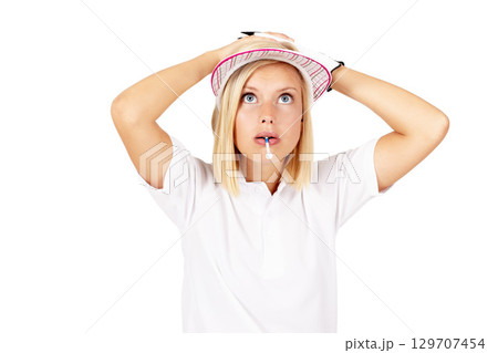 Golf, mistake and game with a sports woman in studio isolated on a white background looking worried. Shocked, surprised and biting a tee with a female golfer standing hands on head on blank space Golf, mistake and game with a sports woman in studio isolated on a white background looking worried. Shocked, surprised and biting a tee with a female golfer standing hands on head on blank space 129707454