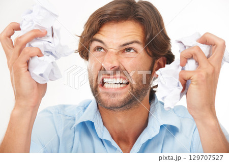 Angry, business man and burnout with tax documents and frustrated worker with white background. Isolated, overworked and anger about mistake with audit paperwork and mental health problem from work Angry, business man and burnout with tax documents and frustrated worker with white background. Isolated, overworked and anger about mistake with audit paperwork and mental health problem from work 129707527