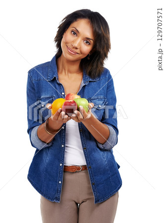 Portrait, fruits or black woman with an orange or apple in studio on white background for healthcare or vegan diet. Smile, wellness or healthy African girl model happy with organic food or vitamin c Portrait, fruits or black woman with an orange or apple in studio on white background for healthcare or vegan diet. Smile, wellness or healthy African girl model happy with organic food or vitamin c 129707571