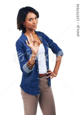 Hand sign, ok meme and portrait of woman with smile on face, agreement and understanding isolated on white background. Motivation, approval and good job finger gesture, happy woman standing in studio 129707648
