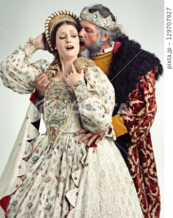 Medieval king, queen and violence in studio for drama, danger and together with renaissance clothes. Ancient royal couple, surprise and shock with distress, crying and actor with vintage fashion Medieval king, queen and violence in studio for drama, danger and together with renaissance clothes. Ancient royal couple, surprise and shock with distress, crying and actor with vintage fashion 129707927