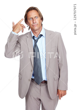 Businessman, gun hand and head in studio with stress, annoyed and tired by white background. Senior corporate executive, isolated and comic hand sign while frustrated, overworked and anxious from job Businessman, gun hand and head in studio with stress, annoyed and tired by white background. Senior corporate executive, isolated and comic hand sign while frustrated, overworked and anxious from job 129707971