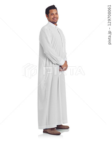 Islamic, muslim and happy man portrait with a islam thobe with a smile about religion and faith. White background, isolated and arabic person smiling with happiness and culture in a studio alone 129708061