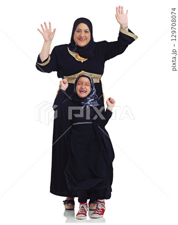 Portrait, children or muslim with a mother and daughter in studio isolated on a white background together as a family. Eid, love or islam with a woman and girl bonding on blank space for religion 129708074