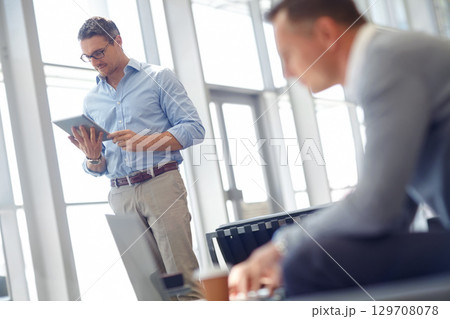 Tablet, corporate or business man standing in airport lobby for invest strategy, finance growth or financial success. CEO, travel or manager with tech planning, social media or network blog Tablet, corporate or business man standing in airport lobby for invest strategy, finance growth or financial success. CEO, travel or manager with tech planning, social media or network blog 129708078