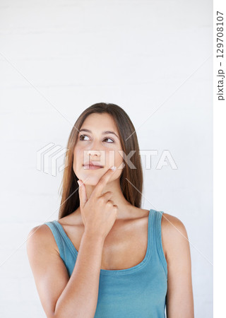 Hand, woman and thinking in studio with an idea, vision and decision on white background space. Ideas, choice and girl planning, pensive and thoughtful while standing, contemplate and isolated Hand, woman and thinking in studio with an idea, vision and decision on white background space. Ideas, choice and girl planning, pensive and thoughtful while standing, contemplate and isolated 129708107